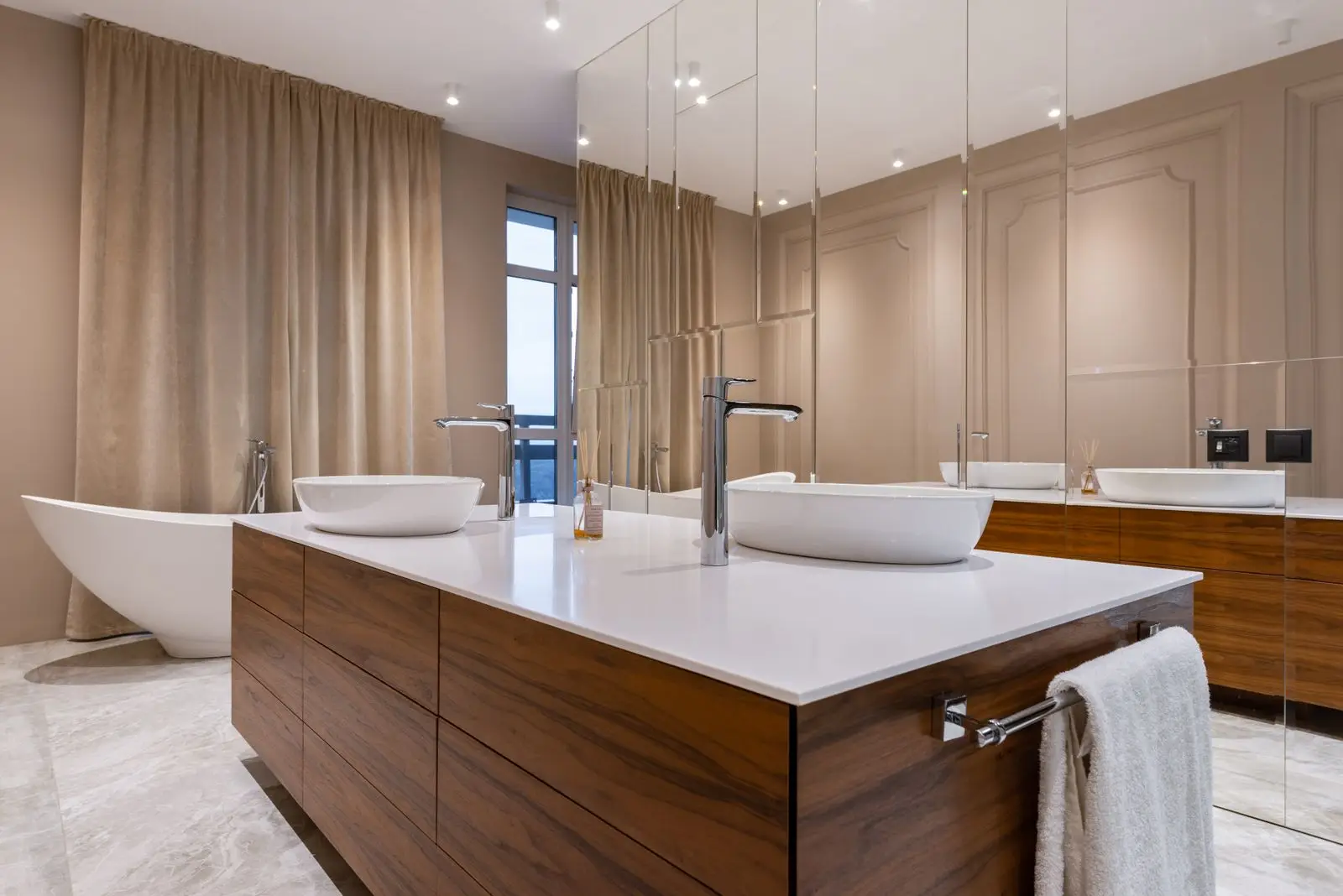 A panelled bathroom in warm oak and stone, designed and built by AVERLY