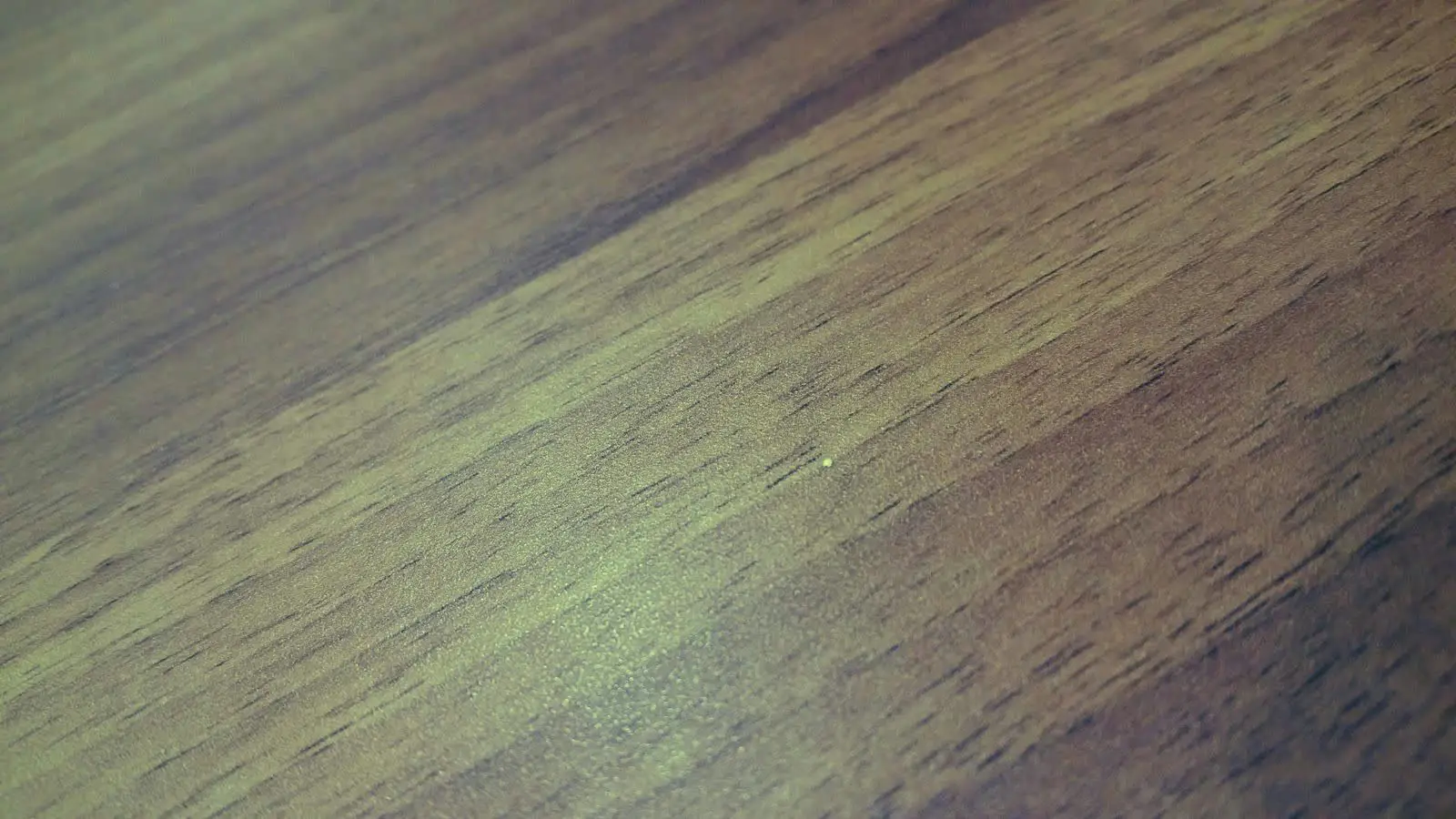 Close grain of dark oiled walnut