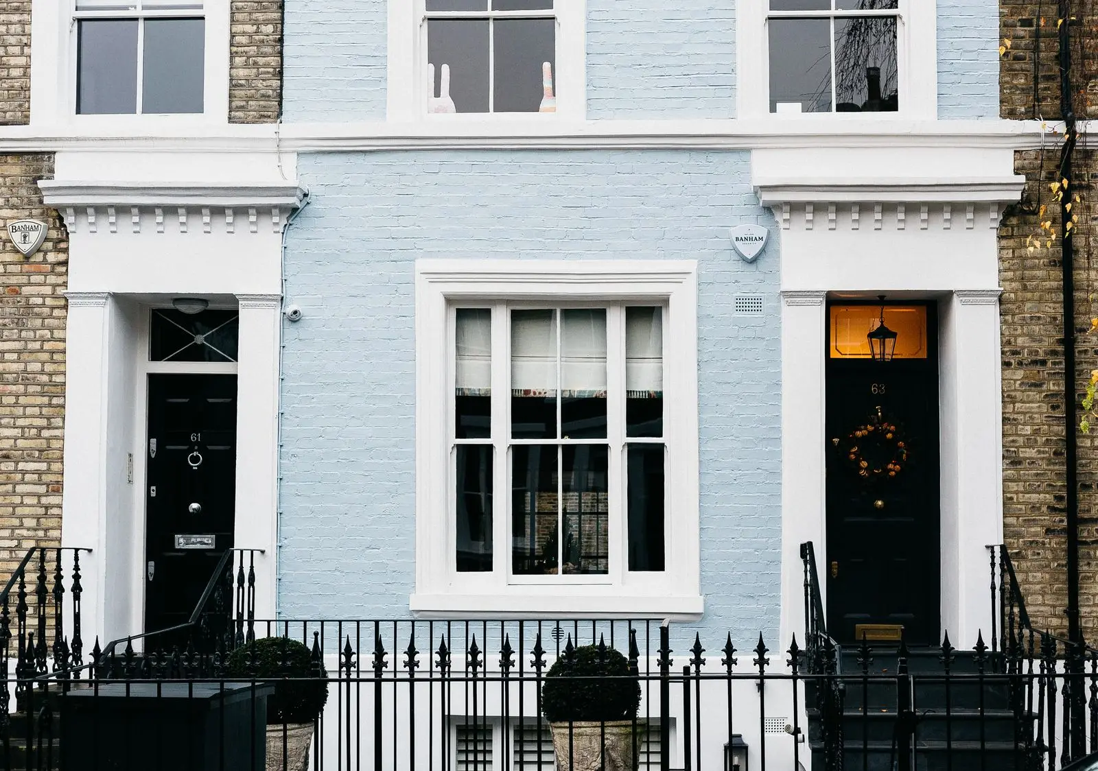 The retained white stucco facade of Redborne Mews